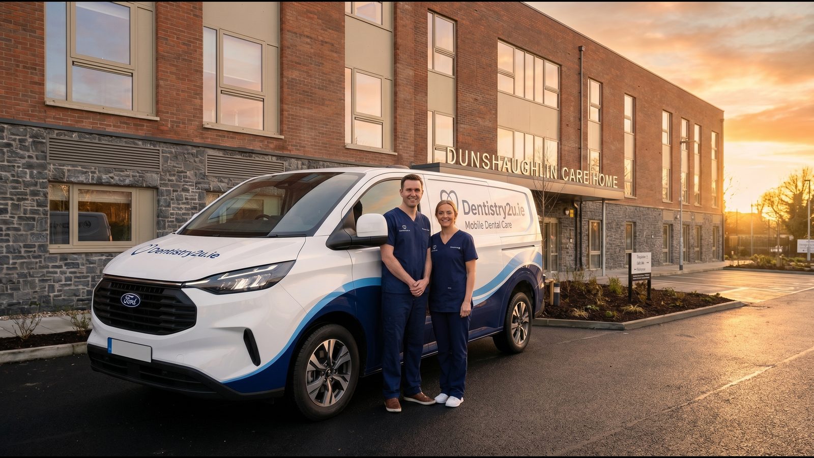 The Dentistry2U van and two clinicians outside a care home at dusk